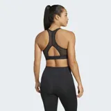 Top deportivo negro de soporte ligero, con escote redondo y espalda tipo racer-back. Presenta el logo grande de Adidas en color blanco en el frente.