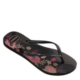 Sandalias tipo ojota Havaianas modelo Slim Organic, color negro con estampado floral en tonos rosados y naranjas. Presentan tiras finas de goma con textura y logo de la marca en relieve.
