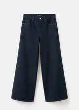 Jeans de denim azul oscuro con corte holgado y diseño de pernera ancha.