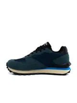 Championes urbanos Umbro para hombre, de color negro con detalles en gris y suela dentada bicolor en blanco y negro.