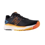 Championes de running New Balance Fresh Foam Evoz, color negro con detalles en azul y naranja.