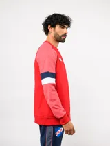 Buzo de cuello redondo del Club Nacional de Football, color azul marino con mangas grises y franjas rojas y blancas en los brazos. Incluye el escudo del club en el pecho y logos de Umbro y BBVA.