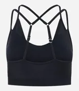 Top deportivo negro de microfibra con efecto satinado, copas removibles y correas dobles ajustables.