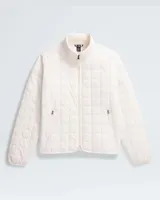 Campera blanca acolchada con cierre frontal, cuello alto y bolsillos laterales con cierre.