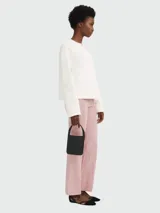 Cartera mini de cuero Longchamp modelo Le Foulonné, color negro, con asa corta y cierre superior.