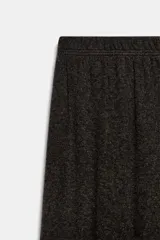 Pantalón bombacho de tiro medio en color gris melange, con cintura y puños elásticos.