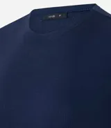 Blusa de manga corta, cuello redondo y corte ajustado, confeccionada en tejido rib de algodón.