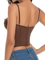 Corset negro de encaje y tul con estructura de varillas, escote corazón y tirantes finos. Presenta detalles de encaje en los bordes y paneles laterales transparentes.