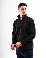 Buzo de polar negro con cuello alto y cierre frontal parcial. Presenta mangas largas y un diseño versátil ideal para climas fríos.