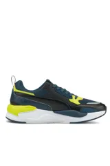 Championes deportivos Puma X-Ray en combinación de azul, gris y negro, con detalles en amarillo flúor y suela blanca y azul.