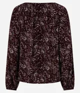 Blusa de viscosa con estampado de follaje, escote canoa con lazo delantero y mangas largas abullonadas.