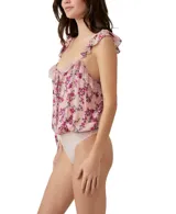 Body blanco con estampado floral celeste, con breteles finos con volados y detalles de encaje.