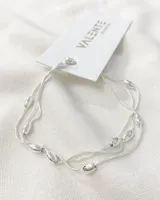 Pulsera de plata 925 con tres hilos y cuentas ovaladas.