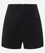 Short pollera corto de sastrería, marca Blue Steel, con diseño cruzado de traspase redondeado y cierre con cremallera en la espalda.