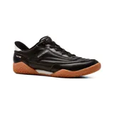 Championes deportivos Skechers Slip-Ins Zinger Evo Off The Pitch, color negro con suela de goma marrón y detalles en blanco. Cuentan con parte superior de piel sintética, cordones elásticos fijos y tecnología Hands Free Slip-ins.