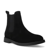 Botas tipo Chelsea de mujer, confeccionadas en cuero negro, con paneles elásticos laterales y suela plana de goma.