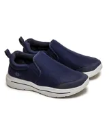 Championes slip-on de color azul marino, con suela blanca y diseño sin cordones, tipo alpargata moderna o zapatilla urbana de lona.