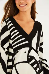 Sweater de tricot con escote en V, manga larga y diseño estampado en blanco y negro con motivo de tucán.