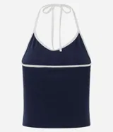 Top frente única de algodón en color azul marino con ribetes blancos en el cuello y rayas laterales. Presenta un estampado frontal con la inscripción Nashville y detalles en blanco. Diseño sin mangas con lazo para anudar al cuello.