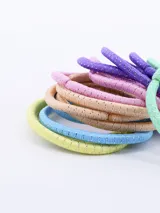 Pack de 12 gomitas de pelo elásticas de colores pastel con detalles brillantes.