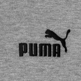 Remera polo Puma de hombre, color gris melange, con cuello y puños acanalados, cierre frontal de botones y logo de la marca estampado en el pecho.