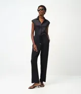 Pantalón de corte recto confeccionado en tejido airflow de poliéster. Presenta cintura elástica con cinturón de lazo del mismo tejido y diseño fluido.