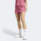 Short de running Adidas Adi365 Essentials, color rosa, con diseño liviano, calzoncillo interior de sujeción y logo reflectante de la marca en la pierna.