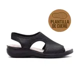 Sandalias negras con plataforma baja, capellada con abertura y plantilla de cuero.
