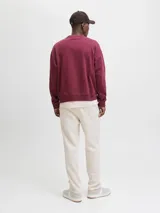 Pantalon de buzo color beige, corte recto, confeccionado en tejido de algodón con cintura elastizada.