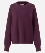 Buzo suéter de tricot con cuello redondo y puños ajustados, de diseño clásico y versátil.