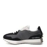 Championes New Balance modelo 327, con capellada en tonos negro, gris oscuro y gris claro. Presenta el logo 'N' sobredimensionado en gris claro y suela de goma blanca con relieve.