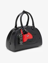 Minibolso charm Diesel Play con diseño inspirado en un control de videojuegos, confeccionado en material de acabado brillante color rojo. Presenta el icónico logo metálico Oval D en el frente y un gancho superior tipo llavero con correa.