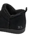 Bota corta tipo botineta de acabado gamuzado en color negro, con interior forrado en piel sintética y suela de goma dentada.