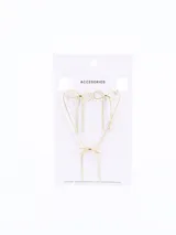 Collar dorado con dije de moña.