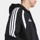 Canguro deportivo Adidas de corte holgado, confeccionado en tejido polar. Presenta capucha con cordón de ajuste, puños acanalados, bolsillos con cierre y diseño con inserciones en el pecho y las icónicas tres tiras en las mangas.