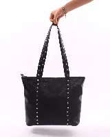 Cartera tipo tote de cuero natural con cierre superior, doble asa de hombro y bolsillo interior.