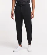 Pantalón deportivo de corte jogger, color negro, con cintura elástica ajustable mediante cordón, bolsillos laterales y puños acanalados en los tobillos. Confeccionado en tejido de algodón con interior felpudo.