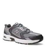 Championes urbanos New Balance modelo 530, con diseño retro de estilo deportivo. Presentan una combinación de malla técnica y paneles sintéticos en tonos grises y verdes oscuros, con entresuela blanca equipada con tecnología ABZORB para mayor amortiguación.