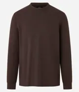 Remera de manga larga con cuello redondo y textura, de corte regular. Confeccionada en una mezcla de algodón, poliéster y viscosa.