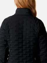 Campera técnica de plumón Mountain Hardwear, color negro, con diseño acolchado elástico, cuello alto, cierre frontal completo y bolsillos laterales con cremallera.