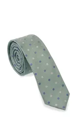Corbata angosta color verde agua con estampado de flores pequeñas en azul y blanco.