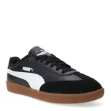Championes urbanos Puma modelo 9T W, color blanco con detalles en negro y puntera de gamuza en tono beige. Presenta suela de goma color caramelo y logo de la marca en dorado.