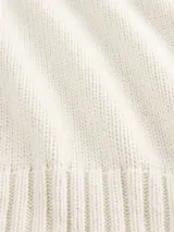 Buzo de punto de algodón con cuello redondo, mangas largas con hombros caídos y puños y ruedo acanalados. Diseño de corte holgado.