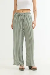 Pantalón palazzo de algodón a rayas verticales rosas y blancas, con cintura elástica ajustable con cordón.