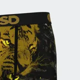 Calzoncillos tipo bóxer con estampado de tigre, rayos y adornos barrocos en tonos dorados y negros.