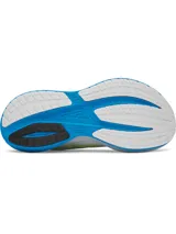 Championes de running Under Armour modelo Velociti Distance, con tecnología de amortiguación HOVR+ de longitud completa. Presentan un diseño en color blanco con detalles en azul vibrante y amarillo neón, parte superior de malla técnica transpirable y suela con marco translúcido para mayor estabilidad.