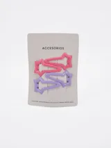 Pack de cuatro pinzas para el cabello en tonos rosado y lila con diseño de estrella troquelada.