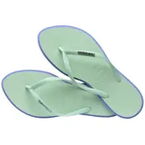 Ojotas Havaianas modelo Slim Point, con base color violeta claro y borde lateral en tono rojizo. Presentan tiras finas con textura y logo de la marca en relieve.