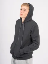 Campera deportiva unisex color beige, confeccionada en algodón con felpa, con capucha, cierre frontal y bolsillo tipo canguro.