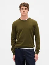Buzo de punto con cuello redondo y puños acanalados, de diseño liso y corte clásico.